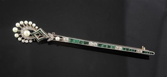 An Art Deco gold and platinum, emerald, diamond and seed pearl brooch, 9cm.